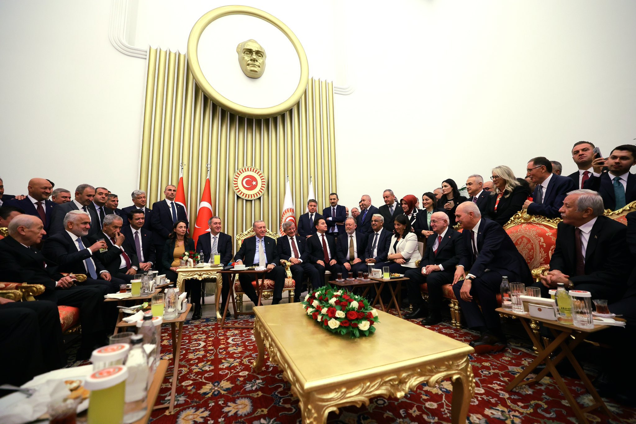 Opposition leaders accused of giving Erdoğan legitimacy by crowding around his table at parliament opening